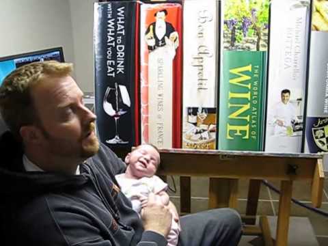 John-Mark Gleadow in his art studio with his child